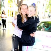 jojo siwa and girlfriend kylie prew smiling in los angeles, california on september 4, 2021